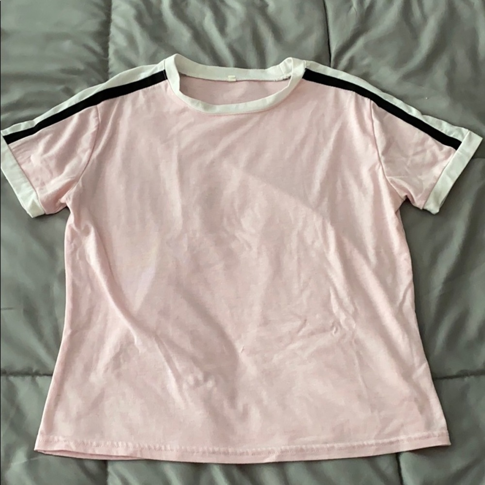 Pink t-shirt with black and white strips.